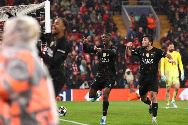 Paris Saint-Germain's French forward #10 Ousmane Dembele (C) celebrates scoring the team's second goal during the UEFA Champions League quarter final, second-leg football match between Liverpool and Paris Saint-Germain at Anfield in Liverpool, north west England on April 14, 2026. (Photo by FRANCK FIFE / AFP)