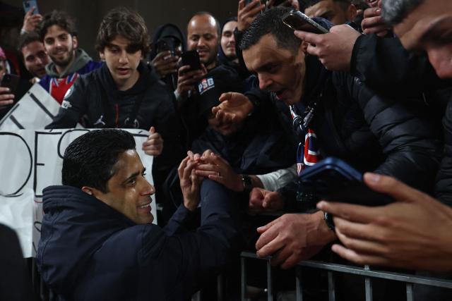 Paris Saint Germain's Qatari president Nasser al-Khelaifi meets fans following the UEFA Champions League quarter final, second-leg football match between Liverpool and Paris Saint-Germain at Anfield in Liverpool, north west England on April 14, 2026. (Photo by Franck FIFE / AFP)