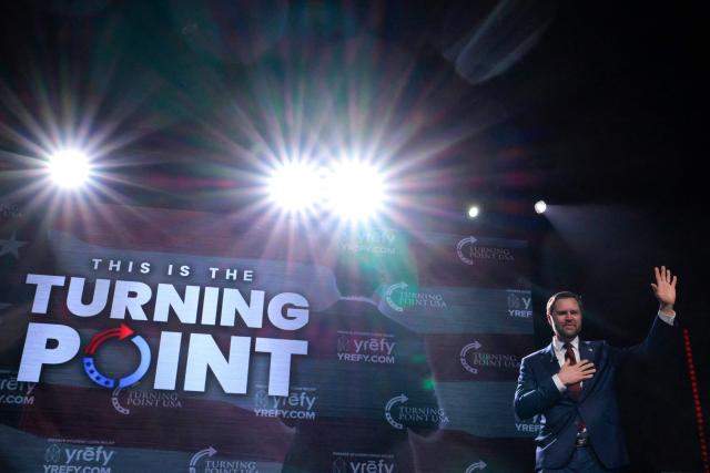 US Vice President JD Vance reacts as he takes the stage before speaking during a Turning Point USA event at the Akins Ford Arena at Classic Center in Athens, Georgia, on April 14, 2026. Vance has continued to support TPUSA and its mission following the 2025 murder of the conservative student organization's founder and leader, far-right activist Charlie Kirk. (Photo by Chip Somodevilla / POOL / AFP)