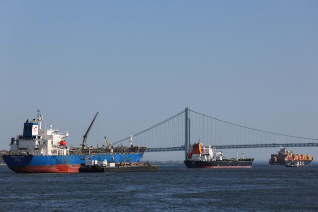 Ships sit in New York Harbor in New York City on April 14, 2026. (Photo by ANGELA WEISS / AFP)