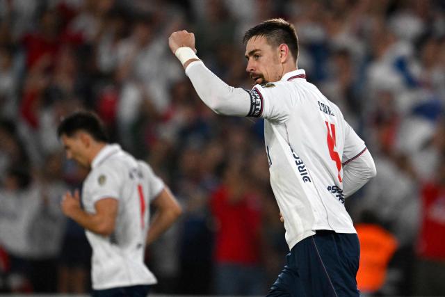 Nacional's defender #04 Sebastian Coates celebrates scoring his team's second goal during the Copa Libertadores group stage football match between Uruguay's Nacional and Colombia's Deportes Tolima at the Gran Parque Central stadium in Montevideo on April 14, 2026. (Photo by Eitan ABRAMOVICH / AFP)