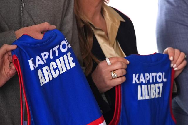 Britain's Prince Harry, Duke of Sussex, is presented with Western Bulldogs Archie and Lilibet jerseys during a visit to a Movember event at Whitten Oval in Melbourne on April 15, 2026. (Photo by Jonathan Brady / POOL / AFP)
