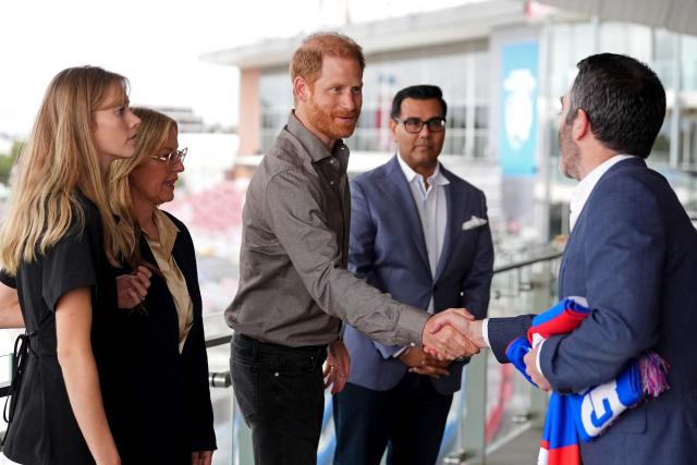 Britain's Prince Harry, Duke of Sussex meets Bulldogs officials before being presented with Western Bulldogs Archie and Lilibet jerseys during a visit to a Movember event at Whitten Oval in Melbourne on April 15, 2026. (Photo by Jonathan Brady / POOL / AFP)