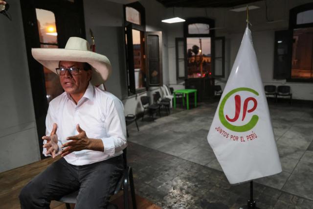 Peru's presidential candidate for the Juntos por el Peru party, Roberto Sanchez, gestures as he speaks during an interview with AFP at his campaign office in Lima on April 14, 2026. Ultra-conservative candidate Rafael Lopez Aliaga, who is vying for a spot in the runoff of Peru’s presidential election, called on election authorities on April 14 to declare the election “null and void” due to unproven irregularities in the process. (Photo by Connie FRANCE / AFP)