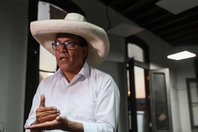 Peru's presidential candidate for the Juntos por el Peru party, Roberto Sanchez, gestures as he speaks during an interview with AFP at his campaign office in Lima on April 14, 2026. Ultra-conservative candidate Rafael Lopez Aliaga, who is vying for a spot in the runoff of Peru’s presidential election, called on election authorities on April 14 to declare the election “null and void” due to unproven irregularities in the process. (Photo by Connie FRANCE / AFP)