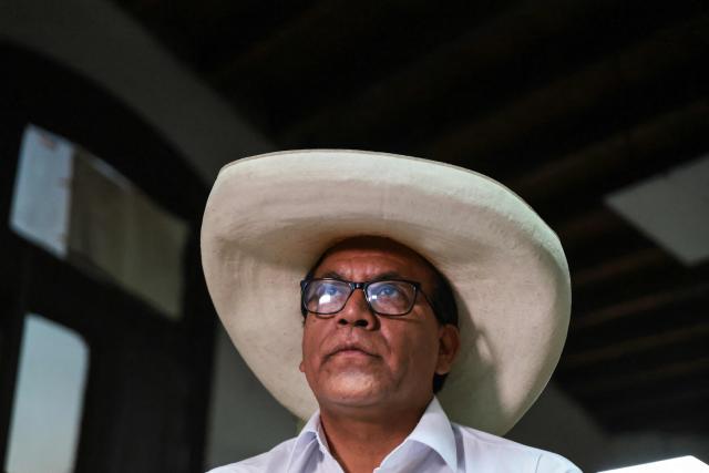 Peru's presidential candidate for the Juntos por el Peru party, Roberto Sanchez, looks on during an interview with AFP at his campaign office in Lima on April 14, 2026. Ultra-conservative candidate Rafael Lopez Aliaga, who is vying for a spot in the runoff of Peru’s presidential election, called on election authorities on April 14 to declare the election “null and void” due to unproven irregularities in the process. (Photo by Connie FRANCE / AFP)