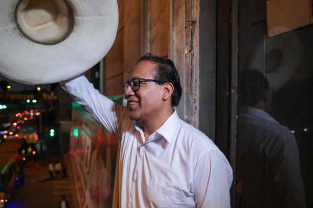 Peru's presidential candidate for the Juntos por el Peru party, Roberto Sanchez, gestures after an interview with AFP at his campaign office in Lima on April 14, 2026. Ultra-conservative candidate Rafael Lopez Aliaga, who is vying for a spot in the runoff of Peru’s presidential election, called on election authorities on April 14 to declare the election “null and void” due to unproven irregularities in the process. (Photo by Connie FRANCE / AFP)