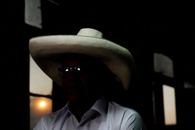 Peru's presidential candidate for the Juntos por el Peru party, Roberto Sanchez, looks on during an interview with AFP at his campaign office in Lima on April 14, 2026. Ultra-conservative candidate Rafael Lopez Aliaga, who is vying for a spot in the runoff of Peru’s presidential election, called on election authorities on April 14 to declare the election “null and void” due to unproven irregularities in the process. (Photo by Connie FRANCE / AFP)