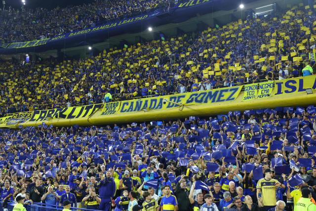 Boca Juniors fans cheer before the Copa Libertadores group stage football match between Argentina's Boca Juniors and Ecuador's Barcelona at the La Bombonera stadium in Buenos Aires on April 14, 2026. (Photo by ALEJANDRO PAGNI / AFP)