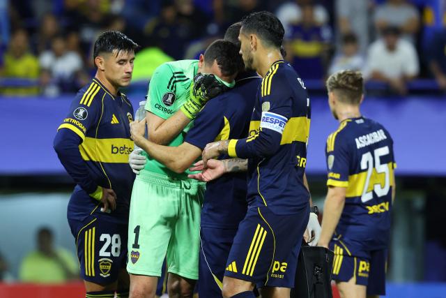 Boca Juniors' goalkeeper #01 Agustin Marchesin cries after an injury during the Copa Libertadores group stage football match between Argentina's Boca Juniors and Ecuador's Barcelona at La Bombonera stadium in Buenos Aires on April 14, 2026. (Photo by ALEJANDRO PAGNI / AFP)