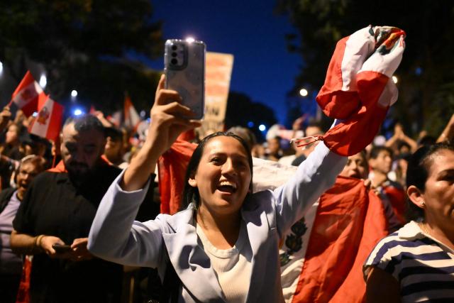 A demonstrator gestures as she takes part in a protest over alleged fraud following the results of the presidential election in front of the National Jury of Elections (JNE) headquarters in Lima on April 14, 2026. Ultra-conservative candidate Rafael Lopez Aliaga, who is vying for a spot in the runoff of Peru’s presidential election, called on election authorities on April 14 to declare the election “null and void” due to unproven irregularities in the process. (Photo by Luis ROBAYO / AFP)