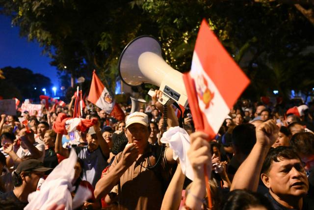 Demonstrators take part in a protest over alleged fraud following the results of the presidential election in front of the National Jury of Elections (JNE) headquarters in Lima on April 14, 2026. Ultra-conservative candidate Rafael Lopez Aliaga, who is vying for a spot in the runoff of Peru’s presidential election, called on election authorities on April 14 to declare the election “null and void” due to unproven irregularities in the process. (Photo by Luis ROBAYO / AFP)