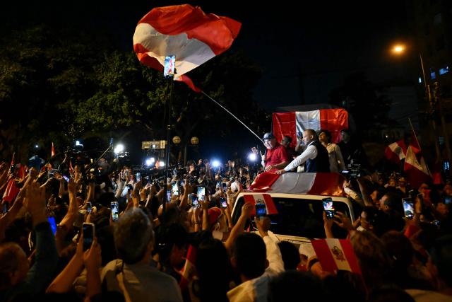 Peru's presidential candidate for the Renovacion Popular party, Rafael Lopez Aliaga, speaks to demonstrators during a protest over alleged fraud following the results of the presidential election in front of the National Jury of Elections (JNE) headquarters in Lima on April 14, 2026. Ultra-conservative candidate Rafael Lopez Aliaga, who is vying for a spot in the runoff of Peru’s presidential election, called on election authorities on April 14 to declare the election “null and void” due to unproven irregularities in the process. (Photo by Luis ROBAYO / AFP)
