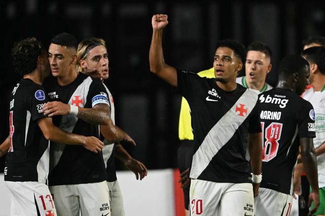 Vasco da Gama's forward #20 Brenner celebrates with teammates after scoring his team's first goal during the Copa Sudamericana group stage football match between Brazil's Vasco da Gama and Chile's Audax Italiano at the Sao Januario stadium in Rio de Janeiro, Brazil, on April 14, 2026. (Photo by MAURO PIMENTEL / AFP)