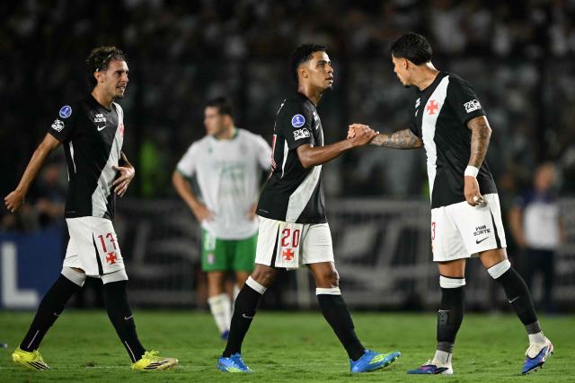 Vasco da Gama's forward #20 Brenner celebrates with Vasco da Gama's defender #43 Lucas Freitas after scoring his team's first goal during the Copa Sudamericana group stage football match between Brazil's Vasco da Gama and Chile's Audax Italiano at the Sao Januario stadium in Rio de Janeiro, Brazil, on April 14, 2026. (Photo by MAURO PIMENTEL / AFP)