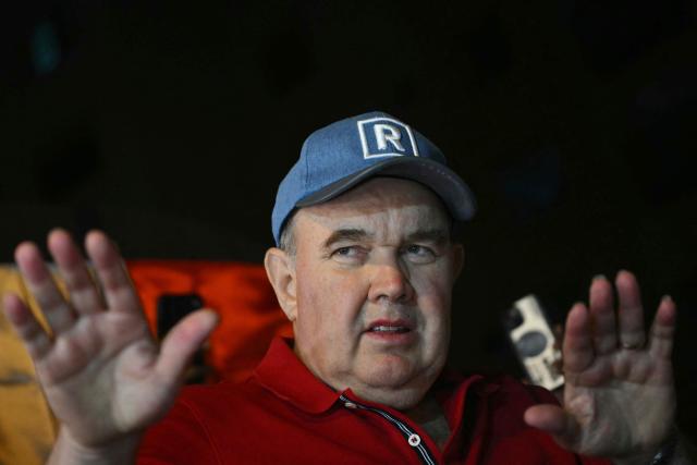 Peru's presidential candidate for the Renovacion Popular party, Rafael Lopez Aliaga, gestures during a protest over alleged fraud following the results of the presidential election in front of the National Jury of Elections (JNE) headquarters in Lima on April 14, 2026. Ultra-conservative candidate Rafael Lopez Aliaga, who is vying for a spot in the runoff of Peru’s presidential election, called on election authorities on April 14 to declare the election “null and void” due to unproven irregularities in the process. (Photo by ERNESTO BENAVIDES / AFP)