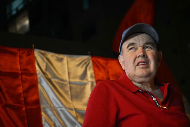 Peru's presidential candidate for the Renovacion Popular party, Rafael Lopez Aliaga, looks on during a protest over alleged fraud following the results of the presidential election in front of the National Jury of Elections (JNE) headquarters in Lima on April 14, 2026. Ultra-conservative candidate Rafael Lopez Aliaga, who is vying for a spot in the runoff of Peru’s presidential election, called on election authorities on April 14 to declare the election “null and void” due to unproven irregularities in the process. (Photo by ERNESTO BENAVIDES / AFP)