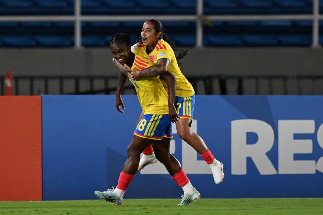 Colombia's forward #18 Linda Caicedo celebrates with Colombia's forward #07 Manuela Pavi after scoring her team's first goal during the CONMEBOL Nations League Women football match between Colombia and Chile, at the Olimpico Pascual Guerrero stadium in Cali, Valle del Cauca, Colombia, on April 14, 2026. (Photo by JOAQUIN SARMIENTO / AFP)