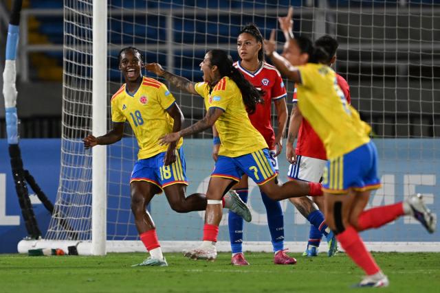 Colombia's forward #18 Linda Caicedo celebrates with teammates after scoring her team's first goal during the CONMEBOL Nations League Women football match between Colombia and Chile, at the Olimpico Pascual Guerrero stadium in Cali, Valle del Cauca, Colombia, on April 14, 2026. (Photo by JOAQUIN SARMIENTO / AFP)