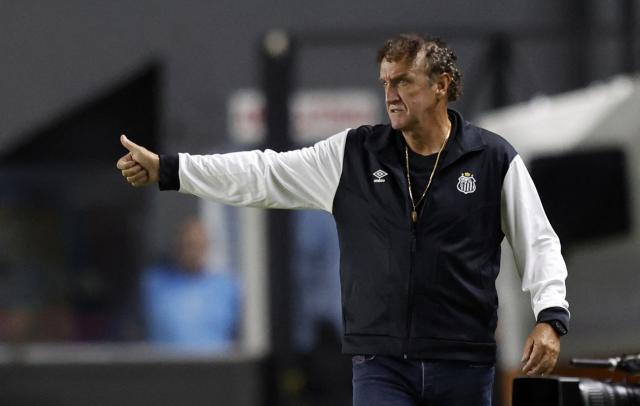 Santos' head coach Cuca gives instructions to his players from the touchline during the Copa Sudamericana group stage football match between Brazil's Santos and Paraguay's Deportivo Recoleta at the Urbano Caldeira stadium in Santos, state of Sao Paulo, Brazil, on April 14, 2026. (Photo by Miguel SCHINCARIOL / AFP)