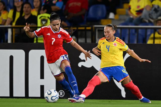 Chile's forward #07 Vaitiare Pardo and Colombia's defender #04 Ana Guzman fight for the ball during the CONMEBOL Nations League Women football match between Colombia and Chile, at the Olimpico Pascual Guerrero stadium in Cali, Valle del Cauca, Colombia, on April 14, 2026. (Photo by JOAQUIN SARMIENTO / AFP)