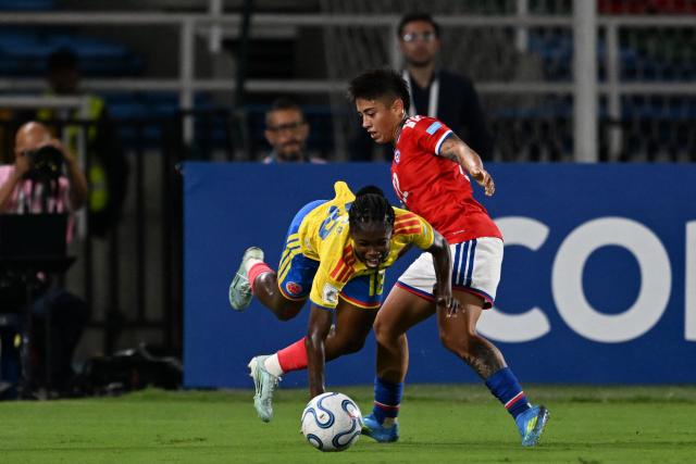 Colombia's forward #18 Linda Caicedo and Chile's defender #22 Valentina Diaz fight for the ball during the CONMEBOL Nations League Women football match between Colombia and Chile, at the Olimpico Pascual Guerrero stadium in Cali, Valle del Cauca, Colombia, on April 14, 2026. (Photo by JOAQUIN SARMIENTO / AFP)