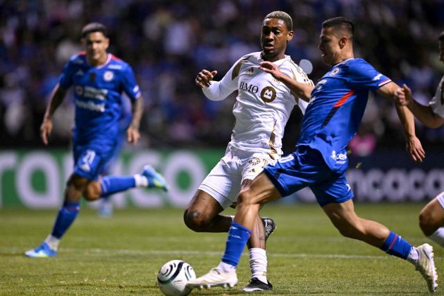 Los Angeles FC's defender #91 Nkosi Tafari and Cruz Azul's midfielder #10 Andres Montano fight for the ball during the CONCACAF Champions Cup quarterfinal football match between Mexico's Cruz Azul and US' Los AngelesFC (LAFC) at Cuauhtemoc stadium in Puebla, Mexico on April 14, 2026. (Photo by YURI CORTEZ / AFP)