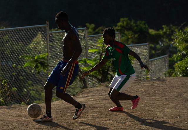 People play football in Petion-ville, Port-au-Prince, Haiti, on April 12, 2026. The Haitian national team has qualified for the 2026 FIFA World Cup, just the second time in its history. Football is the most popular sport in Haiti. (Photo by Clarens SIFFROY / AFP)