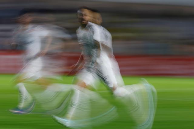 TOPSHOT - This slow shutter speed photograph shows Santos' forward #10 Neymar running during the Copa Sudamericana group stage football match between Brazil's Santos and Paraguay's Deportivo Recoleta at the Urbano Caldeira stadium in Santos, state of Sao Paulo, Brazil, on April 14, 2026. (Photo by Miguel SCHINCARIOL / AFP)
