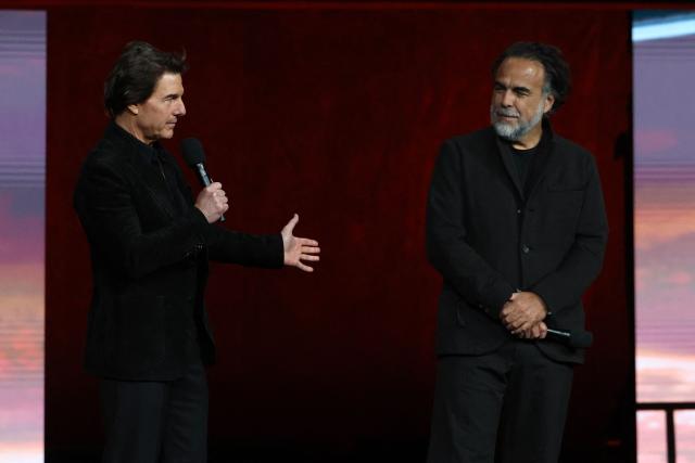 US actor Tom Cruise (L) and Mexican filmmaker Alejandro Gonzalez Inarritu promote the upcoming film "Digger" during the Warner Bros presentation at CinemaCon at The Colosseum at Caesars Palace on April 14, 2026 in Las Vegas, Nevada. (Photo by VALERIE MACON / AFP)