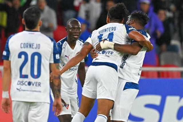 Liga de Quito's defender #14 Jose Quintero (2nd-R) celebrates with teammates after scoring his team's second goal during the Copa Libertadores group stage football match between Ecuador's Liga de Quito and Brazil's Mirassol at the Rodrigo Paz Delgado stadium in Quito on April 14, 2026. (Photo by Rodrigo BUENDIA / AFP)