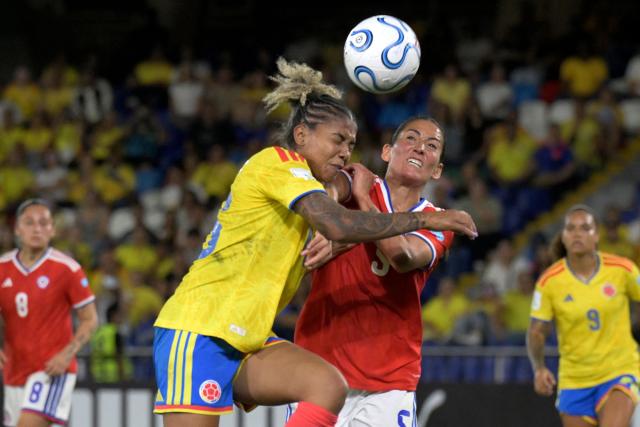 Colombia's defender #16 Jorelyn Carabali and Chile's midfielder #05 Nayadet Lopezfight for the ball during the CONMEBOL Nations League Women football match between Colombia and Chile, at the Olimpico Pascual Guerrero stadium in Cali, Valle del Cauca, Colombia, on April 14, 2026. (Photo by Joaquin SARMIENTO / AFP)