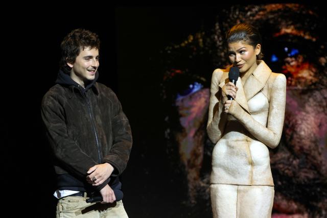 French-US actor Timothee Chalamet and US actress Zendaya promote the upcoming film “Dune: Part Three” during the Warner Bros presentation at CinemaCon at The Colosseum at Caesars Palace on April 14, 2026 in Las Vegas, Nevada. (Photo by VALERIE MACON / AFP)