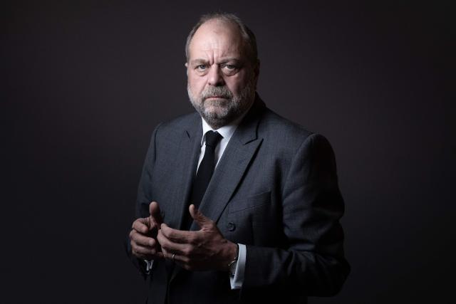 (FILES) French Justice Minister Eric Dupond-Moretti poses in his office during a photo session in Paris on February 24, 2022. The defamation lawsuit filed against Eric Dupond-Moretti by Judge Edouard Levrault will take place in Paris on April 16, 2026. (Photo by JOEL SAGET / AFP)