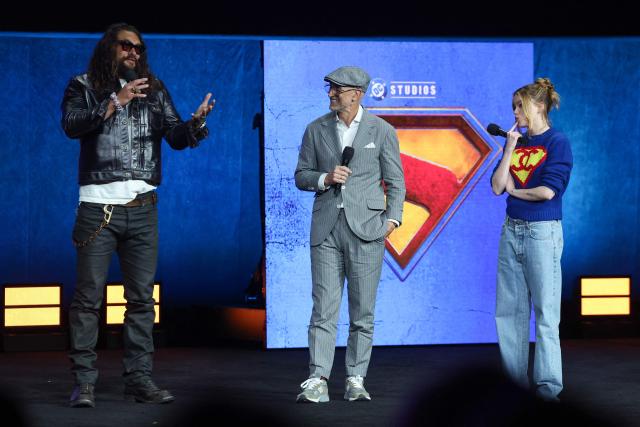 (L/R) US actor Jason Momoa, Australian director Craig Gillespie and Australian actress Milly Alcock promote the upcoming film “Supergirl” promotes the upcoming film “Supergirl” during Warner Bros presentation at CinemaCon at The Colosseum at Caesars Palace on April 14, 2026 in Las Vegas, Nevada. (Photo by VALERIE MACON / AFP)