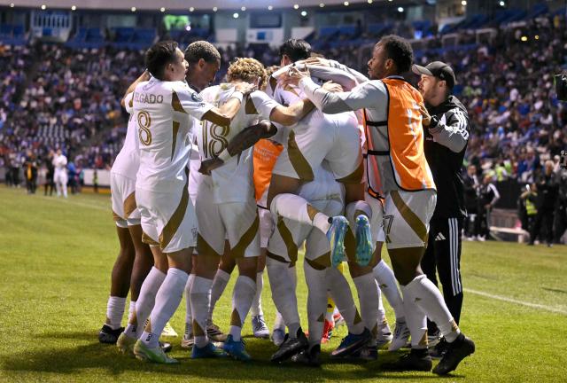 Los Angeles FC players celebrate after the CONCACAF Champions Cup quarterfinal football match between Mexico's Cruz Azul and US' Los AngelesFC (LAFC) at Cuauhtemoc stadium in Puebla, Mexico on April 14, 2026. (Photo by Yuri CORTEZ / AFP)