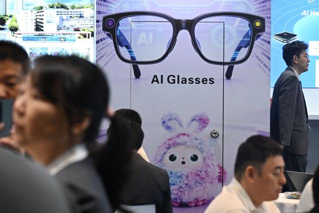 Visitors look at products at the Hong Kong Electronics Fair 2026 at the Convention and Exhibition Centre in Hong Kong on April 15, 2026. (Photo by Peter PARKS / AFP)