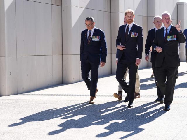 Britain's Prince Harry, the Duke of Sussex (C), visits the Australian War Memorial in Canberra on April 15, 2026. (Photo by Jonathan Brady / POOL / AFP)