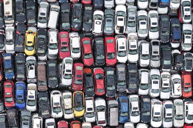 Aerial view of a large number of scrapped cars piled up in an open area on the outskirts of Hangzhou, in China's eastern Zhejiang province, on April 15, 2026. (Photo by CN-STR / AFP) / China OUT