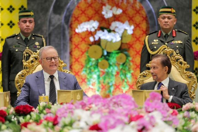 Brunei's Sultan Hassanal Bolkiah (front R) and Australia's Prime Minister Anthony Albanese (front L) talk before their official luncheon at Istana Nurul Iman in Bandar Seri Begawan on April 15, 2026. Albanese is travelling to Brunei and Malaysia to discuss energy and food security, his office said on April 12, continuing regional efforts to shore up fuel supplies for a nation reliant on imports. (Photo by Muhammad Rudean / AFP)