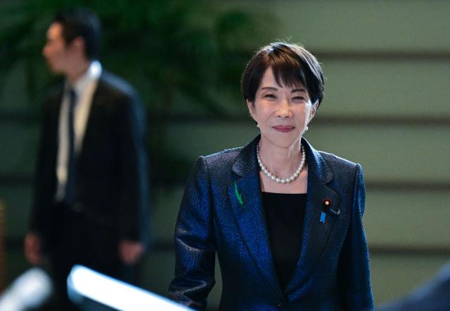 Japan's Prime Minister Sanae Takaichi arrives to a press conference at the Prime Minister's Office in Tokyo on April 15 2026. (Photo by Philip FONG / POOL / AFP)