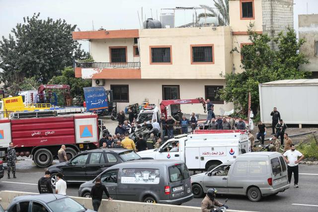 First responders and security forces work at the site of an Israeli airstrike that targeted a vehicle the Lebanese town of Jiyeh, south of Beirut, on April 15, 2026. Two Israeli strikes on April 15 hit vehicles south of Beirut, state media reported, while Hezbollah launched rockets at Israel, hours after Lebanon and Israel agreed to hold direct negotiations. (Photo by MAHMOUD ZAYYAT / AFP)