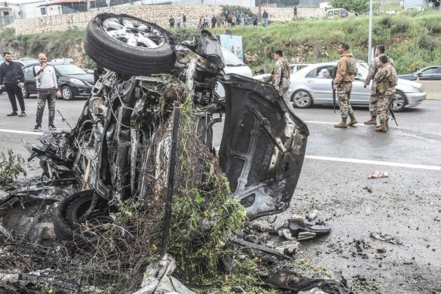 Security forces secure the site of an Israeli airstrike that targeted a vehicle the Lebanese town of Jiyeh, south of Beirut, on April 15, 2026. Two Israeli strikes on April 15 hit vehicles south of Beirut, state media reported, while Hezbollah launched rockets at Israel, hours after Lebanon and Israel agreed to hold direct negotiations. (Photo by MAHMOUD ZAYYAT / AFP)