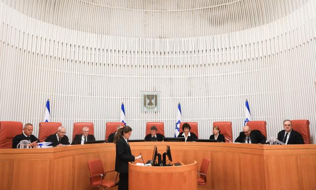 Israeli Supreme Court judges assemble to hear four petitions calling for the removal of Israel's hardline National Security Minister Itamar Ben Gvir, alleging that he has undermined the independence of the police, at the Supreme Court in Jerusalem on April 15, 2026. (Photo by Ronen Zvulun / POOL / AFP)