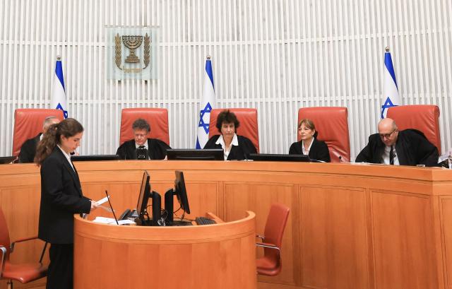 Israeli Supreme Court judges assemble to hear four petitions calling for the removal of Israel's hardline National Security Minister Itamar Ben Gvir, alleging that he has undermined the independence of the police, at the Supreme Court in Jerusalem on April 15, 2026. (Photo by Ronen Zvulun / POOL / AFP)