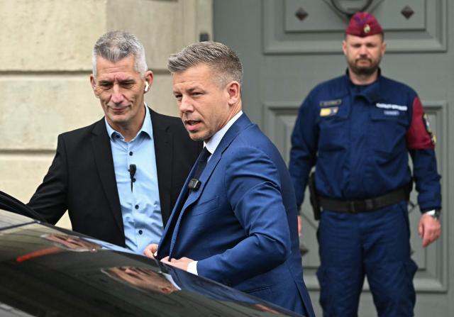 Hungary's Prime minister-elect Peter Magyar gets out of his car as he arrives at the entrance of the Presidential Sandor Palace in Budapest on April 15, 2026 before meeting with Hungary's President and other parliamentary parties, two three days after general elections in Hungary. (Photo by Attila KISBENEDEK / AFP)