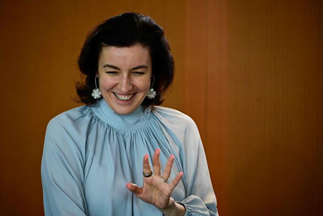 German Minister for Research, Technology and Aerospace Dorothee Baer waves as she arrives ahead a weekly meeting of the German cabinet at the chancellery in Berlin on April 15, 2026. (Photo by Tobias SCHWARZ / AFP)