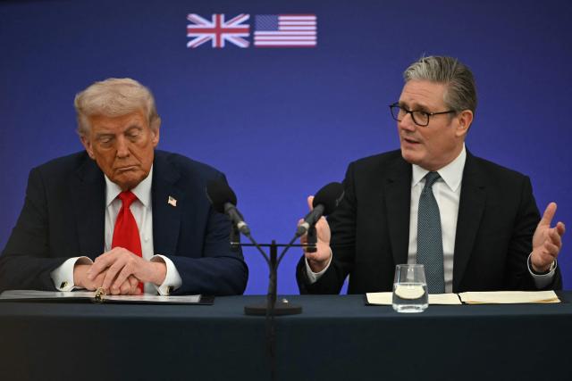 (FILES) Britain's Prime Minister Keir Starmer (R) speaks next to US President Donald Trump (L) at the start of a business event at Chequers in Aylesbury, central England, on September 18, 2025, on the second day of the US president's second state visit. US President Donald Trump on April 15, 2026 has threatened to renege on a trade agreement with the UK, limiting the impact of US tariffs, as he again criticised Britain's lack of support in the Iran war. (Photo by ANDREW CABALLERO-REYNOLDS / AFP)