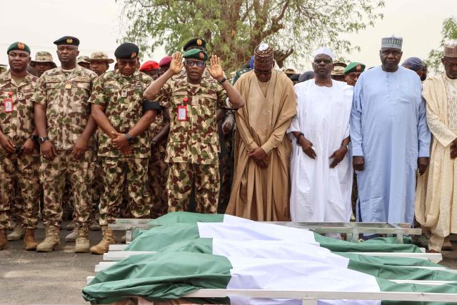 Military officers conduct a burial prayer during the funeral of Brigadier General Oseni Omoh Braimah and other troops killed during last week's attacks, in Maiduguri on April 15, 2026. Brigadier General Oseni Omoh Braimah was the second top military officer to be killed in five months as violence surges across the country's mostly Muslim north.
Africa's most populous country has been fighting a jihadist insurgency for 17 years, since Boko Haram's 2009 uprising, which has seen the emergence of powerful splinter groups including Islamic State West Africa Province (ISWAP). (Photo by Audu MARTE / AFP)