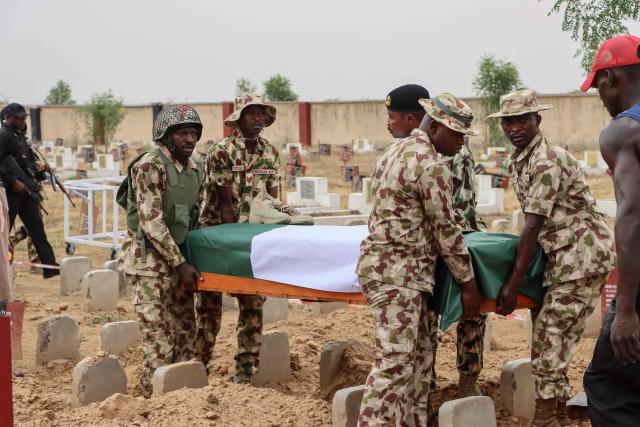Soldiers carry a coffin during the funeral of Brigadier General Oseni Omoh Braimah and other troops killed during last week's attacks, in Maiduguri on April 15, 2026. Brigadier General Oseni Omoh Braimah was the second top military officer to be killed in five months as violence surges across the country's mostly Muslim north.
Africa's most populous country has been fighting a jihadist insurgency for 17 years, since Boko Haram's 2009 uprising, which has seen the emergence of powerful splinter groups including Islamic State West Africa Province (ISWAP). (Photo by Audu MARTE / AFP)